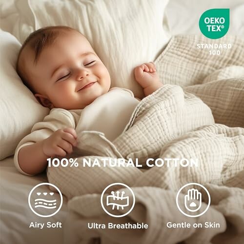 Baby peacefully sleeping under a natural cotton blanket.