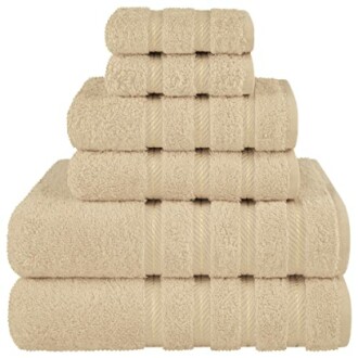 Stack of beige towels in various sizes