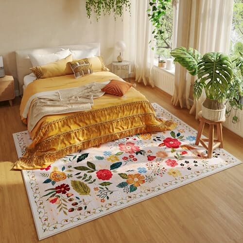 Cozy bedroom with yellow bedding and a colorful floral rug.