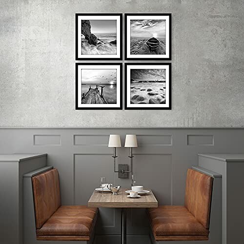 Cafe interior with two booths and black-and-white landscape photo frames on the wall.