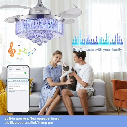 Couple with cat under ceiling fan with built-in speaker and phone app.