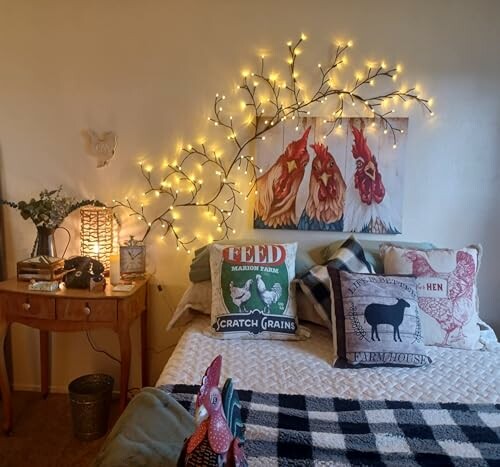 Cozy bedroom with rooster-themed decor, pillows, and string lights.