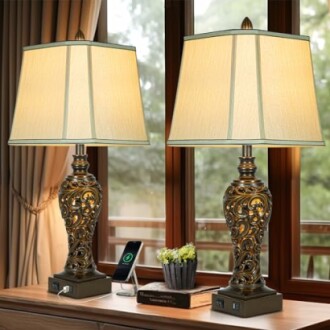 Two ornate table lamps with USB ports on a wooden table.