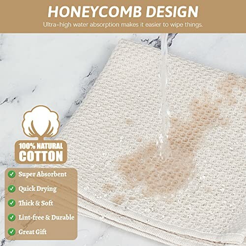 Water being absorbed by a honeycomb design cotton towel.