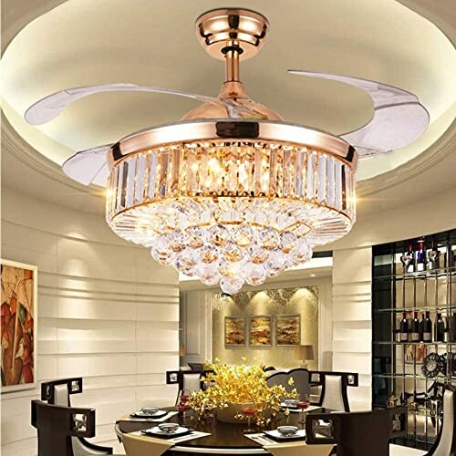 A modern ceiling fan with a chandelier design in a dining room.