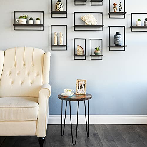 Living room with wall shelves, white chair, and side table.