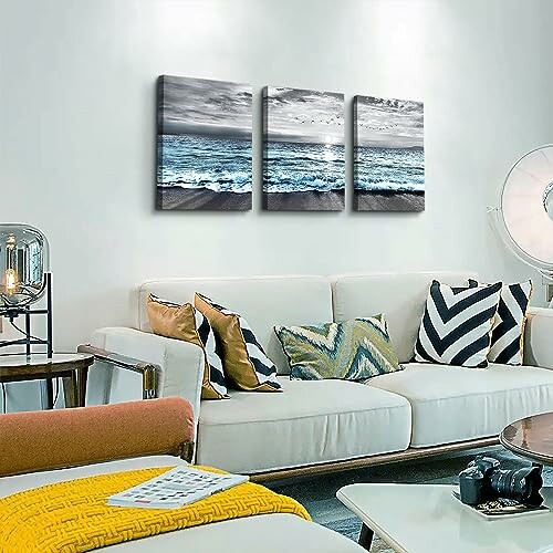 Living room with ocean-themed wall art and modern decor