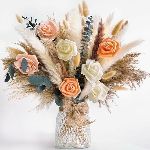 Bouquet with roses, pampas grass, and eucalyptus in a vase.