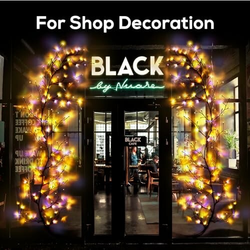 Shop entrance with decorative lights and people inside.