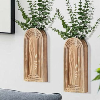 Wooden wall planters with greenery.