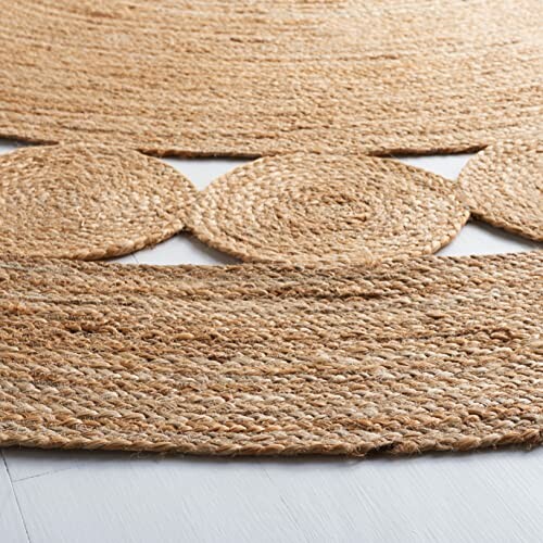 Close-up of a woven jute rug with circular patterns.